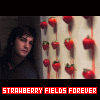 A static image shows a person in a dark top against a light wall with red strawberries, with red text reading "STRAWBERRY FIELDS FOREVER" at the bottom.