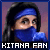 Pixelated image of a person with long dark hair wearing blue headband and high-collared garment, set against purple gradient background.
