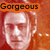 Pixelated image of a face with a neutral expression under an orange banner reading 'Gorgeous' in black text.