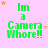 Green text reads "Im a Camera Whore!!" on pink background with orange and white stars; animation cycles star positions across frames.