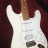 white electric guitars on a dark red background with pixelated text and symbols changing across frames