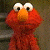A pixelated image of a red Sesame Street character with large white eyes and an orange nose on the left, next to green text reading "Original Icons .com" on a dark background.