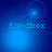 Blue-toned animated icon with 'Sandbox' text and shifting light effects across four