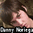 A four- of pixelated images showing a person with brown hair in various poses, including one with yellow flowers and another with text overlays