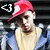 Pixelated image of a person wearing a red and white cap, light-colored shirt, and blue jacket with visible text 'CJ' in the top-left corner.