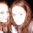 Two pixelated figures with light skin and brown hair, positioned side-by-side against a dark background.