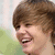 A four- shows a person with brown hair smiling, each featuring a red and black pixelated symbol in the lower right corner