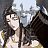 Pixelated static image of two figures in close proximity with indistinct facial features and background elements.