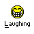 Pixelated yellow circular face with closed eyes and wide toothy grin above the word "Laughing" in pixelated font on gray background.