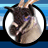 Circular icon with a goat's head in a white circle on blue background, next to blue with pixelated text 'ADAM Sandler .COM' in light and dark gray