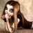 A 48x48 pixel animated buddy icon featuring a cartoon woman with long brown hair and large eyes on the left, next to green text reading "Original Icons .com" on a dark green background.