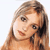 Static pixelated image of a person with light brown hair and fair skin, cropped to show upper face and shoulders against white background.