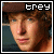 A 50x50 pixel animated buddy icon featuring a person with curly brown hair wearing a brown cap, displayed as two sequential frames in a contact sheet layout.
