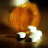 Animated sequence showing a figure with a glowing orange circular background and white smoke-like effects, with text changing from 'life is a' to 'struggle' across frames.
