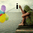 A pixelated image of a seated figure with green clothing holding colorful balloons, displaying text that changes sequentially.