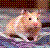Pixelated image of a light brown hamster with pink cheeks and dark eyes, positioned against a multicolored checkered background.
