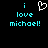 Pixelated cyan text 'i love michael!' on black background with white heart symbol above first line of text.