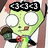 Green cartoon character with large white eyes, black rectangular glasses, and a small red mouth holding a dark green object.