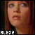 Pixelated close-up of a person's face with reddish-brown hair, showing eyes and mouth against dark background; white text 'ALEX2' at bottom left.