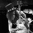 Black-and-white photo of a person playing guitar on left, orange background with yellow text reading "Slash Guitar Legend From Guns N' Roses and Guitar Hero III 10/28/07".
