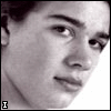 Four- of black-and-white headshots with text overlays: top-left 'I', top-right 'cant', bottom-left 'wait', and empty bottom-right