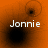 Four orange-tinted display the name 'Jonnier' with varying black circular shapes and faint outlines, arranged in a