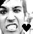 Static grayscale pixel art icon of a stylized face with exaggerated features and a black heart symbol on the right side.