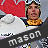 Pixelated image of a person holding a red flag, wearing yellow and blue clothing with white clouds in the background.