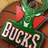 Green dragon head with red cheeks and white eyes on brown basketball background, next to red with green text 'Go Bucks!' in pixelated font