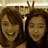 Two people with brown hair pose together on the left; a pink background displays white pixelated text reading "NAOMI AND CARIY = off! ♥".