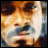 Pixelated static image of a cartoon character with brown hair and light skin, rendered in warm tones on a transparent background.