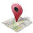 Red pin map marker with black circular hole at top, placed on folded map with green and yellow areas on gray background.