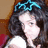 A pixelated image of a person with dark hair wearing a blue headband, with text elements in cyan on dark and light backgrounds.