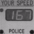 Static grayscale image showing 'YOUR SPEED' text above a digital display reading '15', with 'POLICE' text below, all in pixelated font.