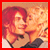Two people with red and blonde hair kiss on a warm-toned background, captured in six showing slight movement