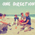 Beach scene with four people on sand, ocean in background, text "ONE BURSTION" at top, pixelated style.