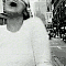 A black-and-white animated sequence shows a person in a white long-sleeve shirt performing various head and body movements against a blurred urban background.