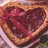 Heart-shaped chocolate box with red ribbon, Elmo holding a heart-shaped container, and text reading 'I love you more than i love elmo' on white background.