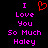 Pixelated text in pink and red on black background with a heart symbol replacing 'love' in the phrase.
