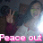 A pixelated image shows a person making a peace sign with their right hand, wearing a dark top and light-colored shirt, with text changing from 'Peace out' to ':)' at the bottom.