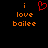 Pixelated orange text 'i love bailee' on black background with red heart symbol above 'i' in left view, identical text without heart in right view.