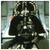 A pixelated image of a dark-cloaked figure with a helmet, standing against a blurred background with light streaks.