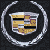 Pixelated icon shows a silver circular frame surrounding a shield-shaped emblem with gold, black, and purple geometric patterns on dark background.