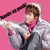 A person in a gray hoodie with pink inner lining holds a silver object against a solid pink background, shown across four
