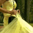 A pixelated image of a person in a yellow dress holding fabric, with yellow text on a black background reading "the best way to predict the future is to create it. I wanna write a whole story with you. I'd call it eternity. & you'd just smile..."