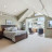 Pixelated static image of a blurred interior space with indistinct furniture and architectural elements.