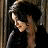 Two side-by-side pixelated frames of a person with dark hair in profile view, left frame showing head turned down-left and right frame showing head turned up-right against light background.