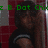 A pixelated image of a person with long dark hair wearing a black shirt, set against red and white checkered background with green text overlays.