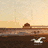 Pixelated beach scene with palm tree, seagull, and distant rock formation, paired with orange text blocks reading 'IN TO', 'SINGL', 'EN HO', and '333333'