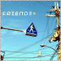 Blue triangular pedestrian sign on a pole against a clear sky with power lines and streetlights, text 'FRIENDS×' in white pixelated font.